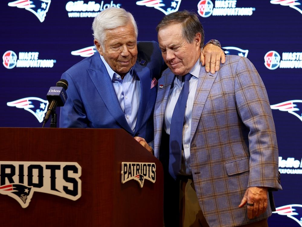 New England Patriots owner Robert Kraft (left) hugs former head coach Bill Belichick during a press conference in 2024.