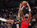 Toronto Raptors forward Brandon Ingram shoots over Denver Nuggets guard Peyton Watson during a game earlier this season.