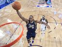 Kawhi Leonard of the Los Angeles Clippers and Team USA Stripes dunks against Pascal Siakam of the Indiana Pacers and Team World during the NBA All-Star Game.