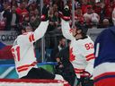 Team Canada's Mark Stone (left) celebrates after scoring goal with Mitch Marner during the Milano-Cortina 2026 Winter Olympic Games.