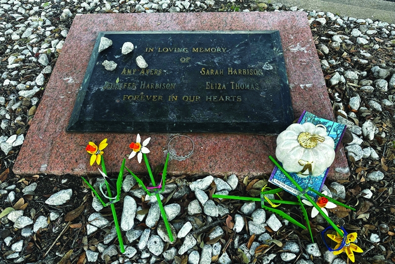  Tributes lay on a memorial Sept. 26, 2025, for four teenage girls who were killed in a yogurt shop in 1991 in Austin, Texas.