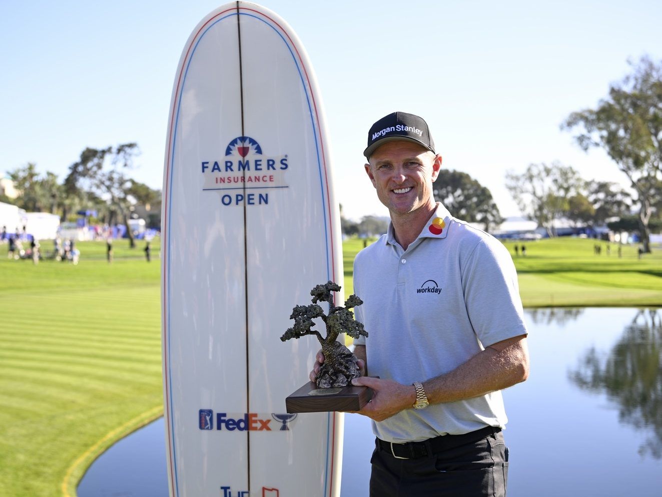 Justin Rose of England poses with the trophy at the Farmers Insurance Open.