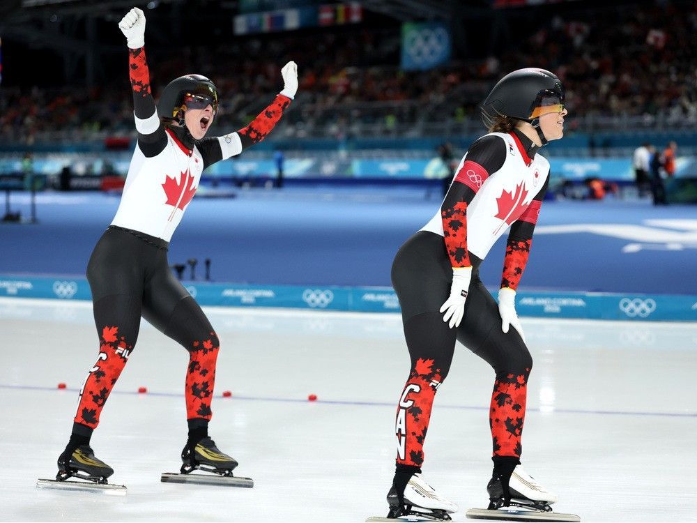 Canadians Valerie Maltais and Ivanie Blondin react after competing in the women's long-track team pursuit semi-final at the Milan-Cortina Games.