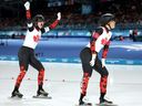 Canadians Valerie Maltais and Ivanie Blondin react after competing in the women's long-track team pursuit semi-final at the Milan-Cortina Games.