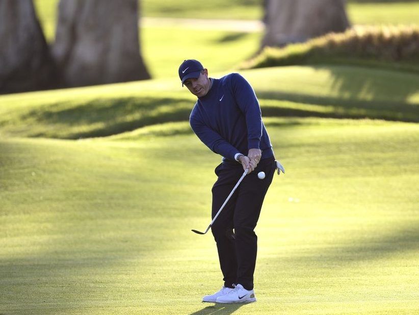 Rory McIlroy of Northern Ireland chips on the 17th green during the first round of The Genesis Invitational 2026 at Riviera Country Club on February 19, 2026 in Pacific Palisades, California.