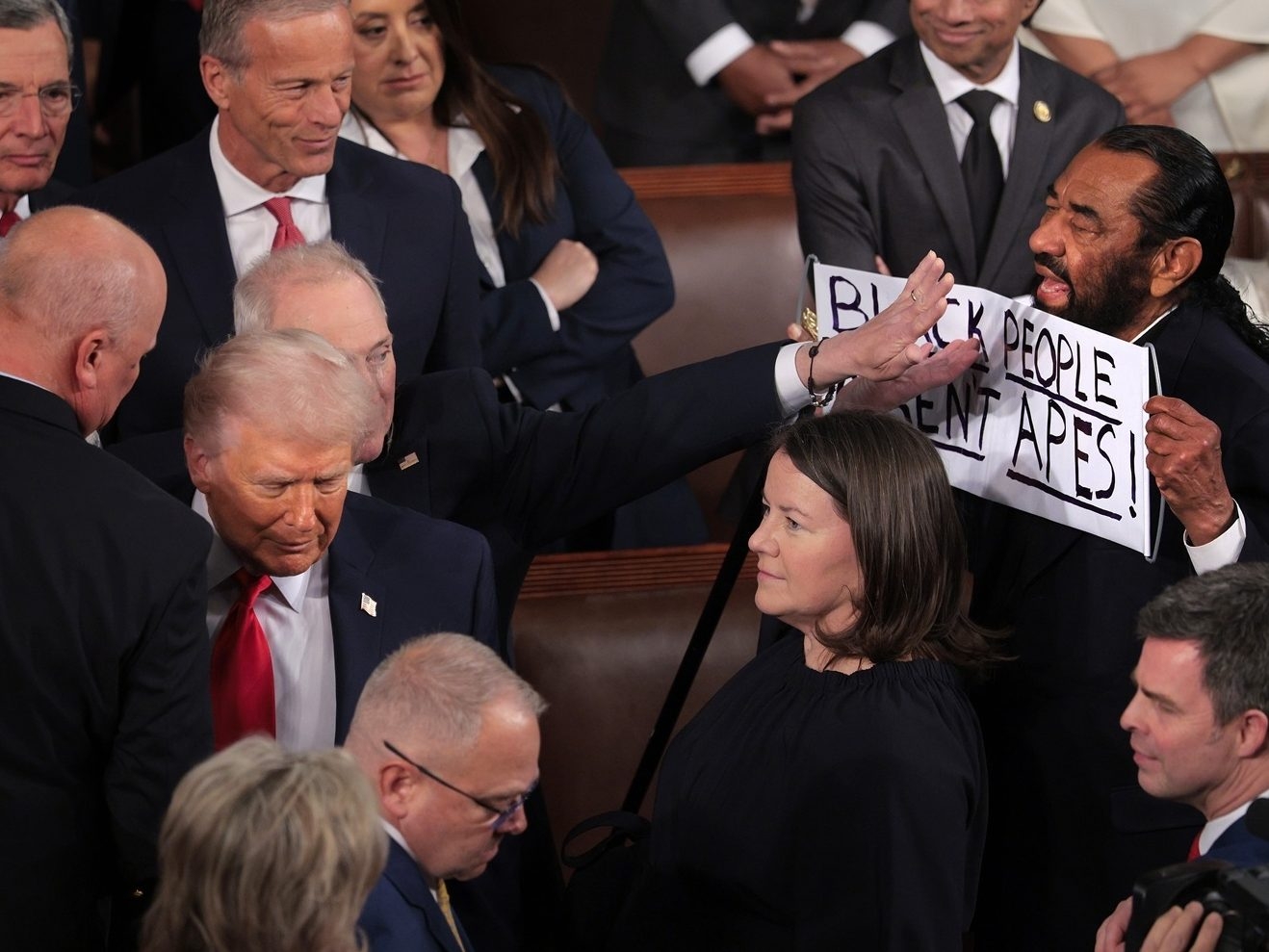  Rep. Al Green (D-TX) holds a sign as U.S. President Donald Trump arrives for his State of the Union address during a Joint Session of Congress at the U.S. Capitol on Tuesday, Feb. 24, 2026, in Washington, D.C. Trump delivered his address days after the Supreme Court struck down the administration’s tariff strategy and amid a U.S. military buildup in the Persian Gulf threatening Iran.