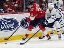 Florida Panthers center Eetu Luostarinen tries to shield the puck against Maple Leafs defenceman Oliver Ekman-Larsson during the second period on Thursday, Feb. 26, 2026, in Sunrise, Fla.