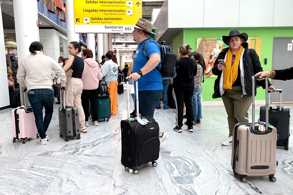  Passengers remain stranded at Guadalajara International Airport following flight suspensions and lack of transport in Tlajomulco, Jalisco State, Mexico, on February 22, 2026. (Ulises Ruiz/AFP/Getty Images)