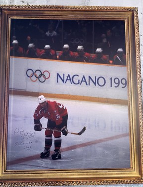 Wayne Gretzky signed a picture of himself competing at the 1998 Nagano Games while attending the Milano Cortina 2026 Winter Olympics in Milan, Italy.