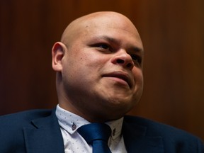 Jamil Jivani in a dark room