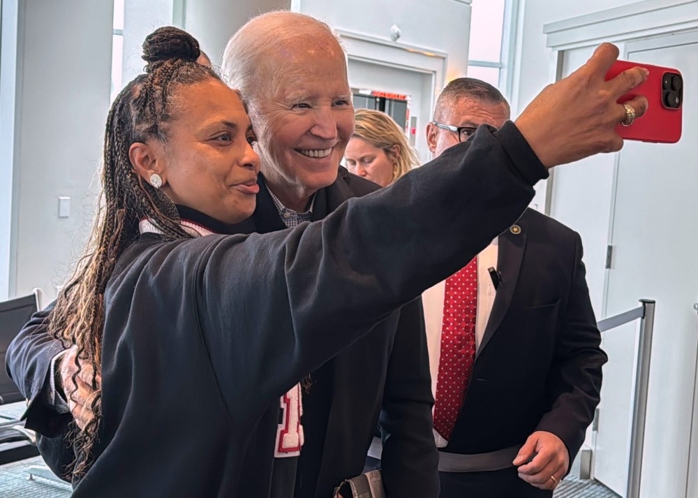 Former U.S. President Joe Biden poses for a selfie as passengers await an outgoing flight, Friday, Feb. 27, 2026 in Columbia, S.C.
