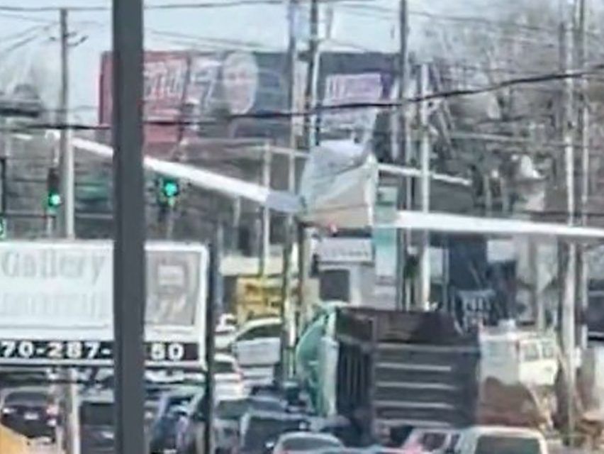 Small plane lands on busy road, striking 3 vehicles