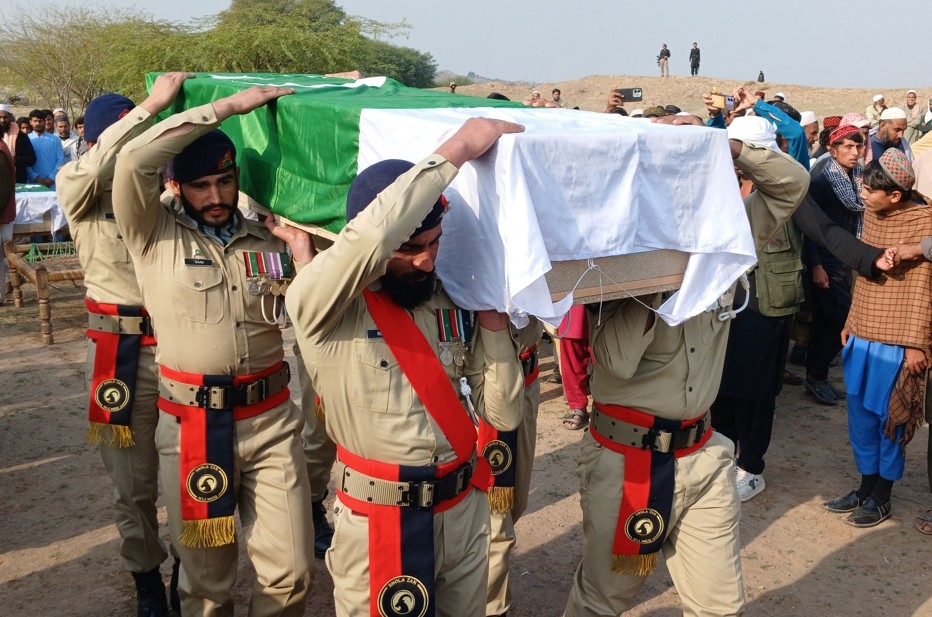  Pakistani soldiers carry the coffin of a security personnel who was killed in militant attacks in Kohat, Khyber Pakhtunkhwa province, on Friday, Feb. 27, 2026.