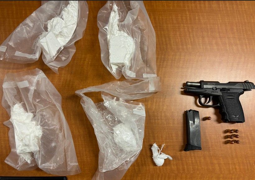 A gun and drugs seized by Toronto Police are pictured in this handout photo.