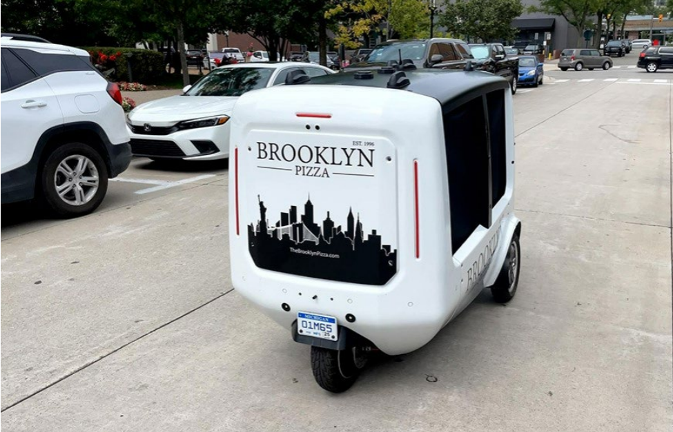  A Magna automated delivery vehicle is seen on a road in Michigan.