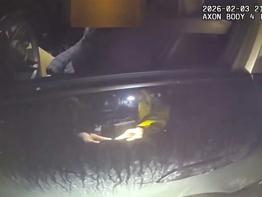 A 57-year-old unidentified driver who was allegedly speeding is pictured in a screengrab of police body-cam footage behind the wheel of his car.