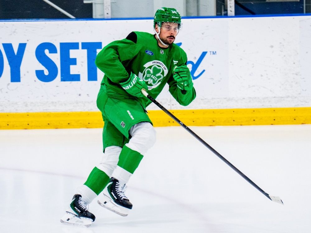 Toronto Maple Leafs' Auston Matthews wears a green uniform during practice.