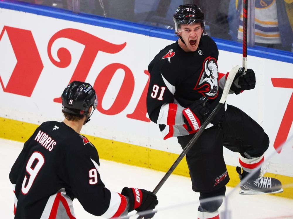 Buffalo Sabres right winger Josh Doan celebrates his goal with Josh Norris against the Tampa Bay Lightning.