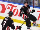 Buffalo Sabres right winger Josh Doan celebrates his goal with Josh Norris against the Tampa Bay Lightning.