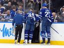 Maple Leafs captain Auston Matthews is helped off the ice after a collision with Anaheim Ducks defenceman Radko Gudas in Toronto on March 12, 2026.