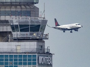 An Air Canada flight lands at Trudeau Airport in Montreal Wednesday Aug. 20, 2025.