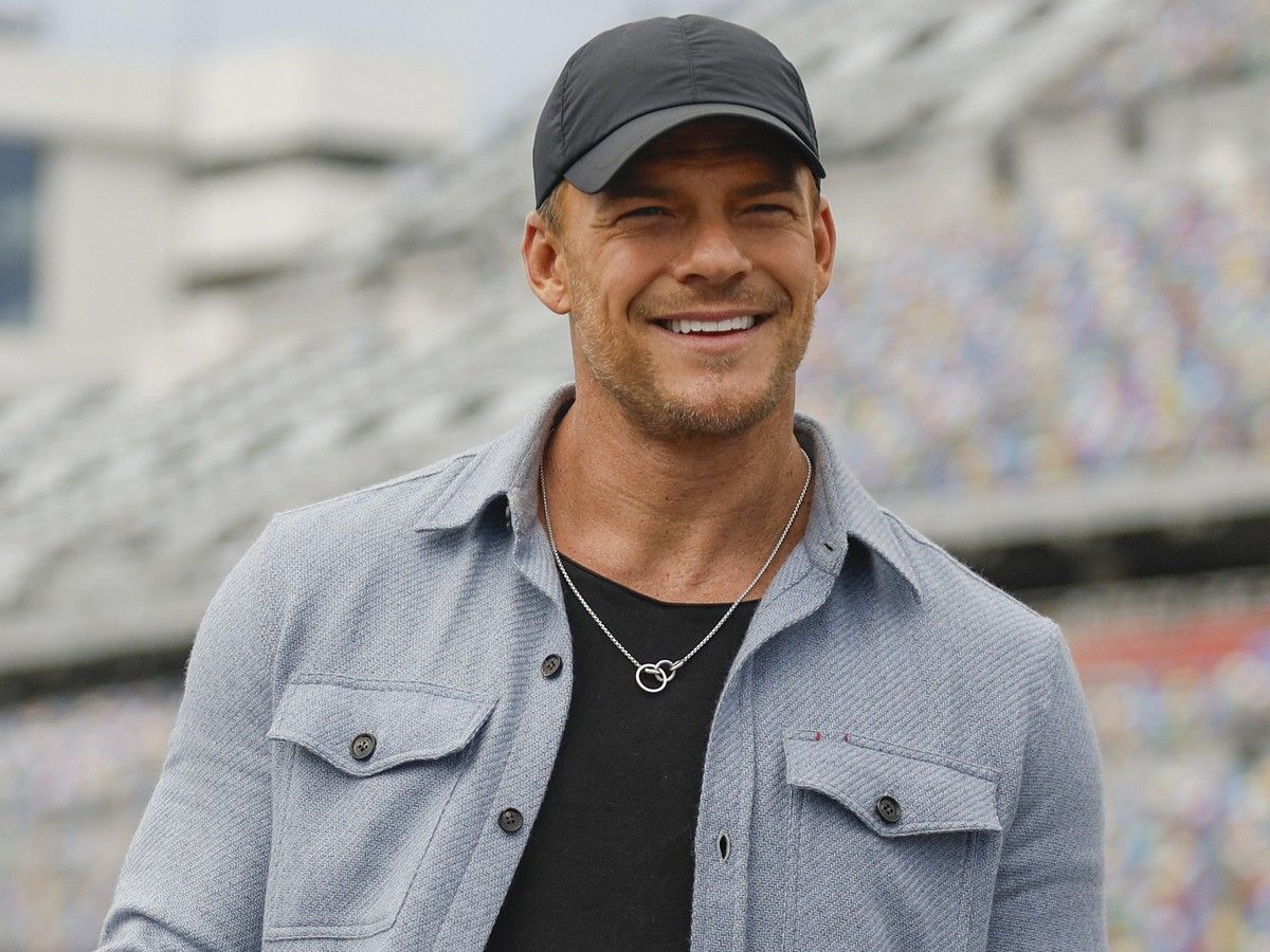 Alan Ritchson poses for photos during pace car training prior to the NASCAR Cup Series Daytona 500 at Daytona International Speedway on Feb. 16, 2025 in Florida.