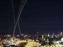 Rocket trails from an interception by Israel's Iron Dome missile defence system are pictured over Jerusalem on March 1, 2026. The United States and Israel launched strikes against Iran on February 28, with Israel's public broadcaster reporting that the Iranian supreme leader had been targeted, as the Islamic republic retaliated with barrages of missiles at Gulf states and Israel.