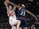 Jakob Poeltl #19 of the Toronto Raptors is fouled by Isaiah Jackson #23 of the LA Clippers in the first half at Intuit Dome on March 25, 2026 in Inglewood, California.