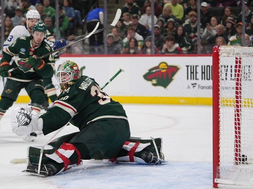 Minnesota Wild goaltender Jesper Wallstedt, right, gives up a goal to Toronto Maple Leafs center Bo Groulx