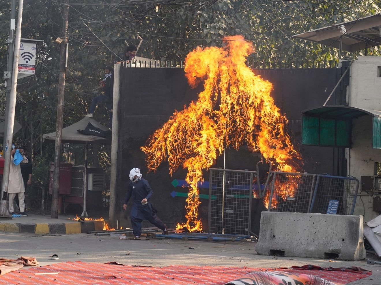 At least 22 people killed in Pakistan as protesters try to storm U.S. Consulate