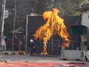 Shiite Muslims set a fire at the U.S. Consulate's entrance gate during a rally to condemn the killing of Iranian Supreme Leader Ayatollah Ali Khamenei, in Lahore, Pakistan, Sunday, March 1, 2026.