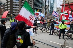 Protesters and counter-protesters demonstrate by the U.S. Consulate during a rally for Al-Quds Day, in Toronto, Saturday, March 14, 2026.