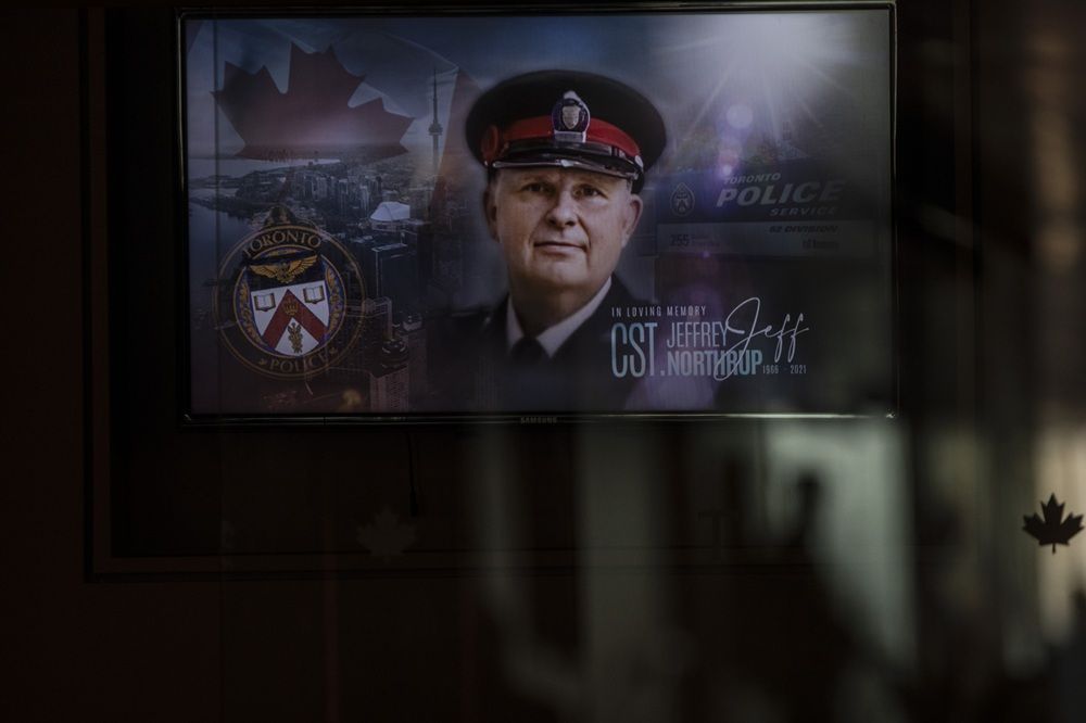 The face of Toronto Police officer Jeffrey Northrup is seen on a plasma screen at his his funeral service, in Toronto on July 12, 2021. CHRIS YOUNG/THE CANADIAN PRESS