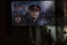 The face of Toronto Police officer Jeffrey Northrup is seen on a plasma screen at his his funeral service, in Toronto on July 12, 2021. CHRIS YOUNG/THE CANADIAN PRESS