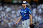 Toronto Blue Jays pitcher Max Scherzer walks to the dugout during the first inning in Game 3 of the World Series against the Los Angeles Dodgers, Monday, Oct. 27, 2025, in Los Angeles.