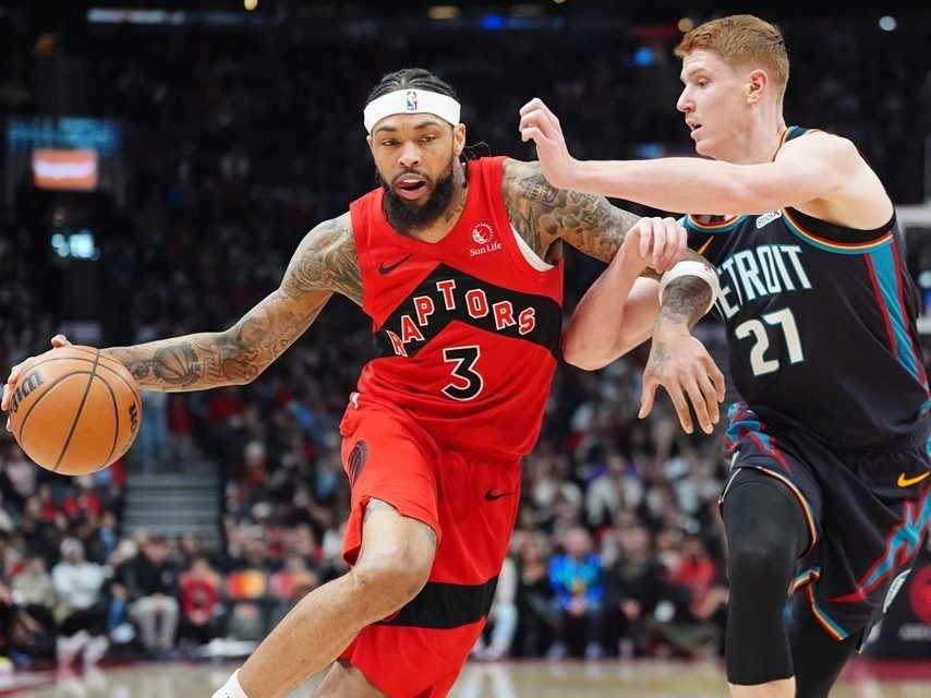 Toronto Raptors forward Brandon Ingram (left) moves the ball up court as Detroit Pistons guard Kevin Huerter defends during the first half in Toronto on Sunday, March 15, 2026. 