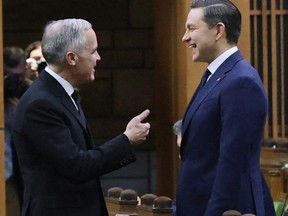 Mark Carney chats with Pierre Poilievre