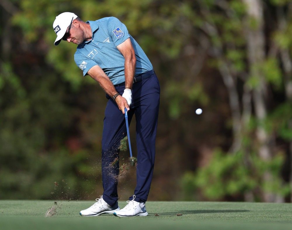 Corey Conners plays a shot on the 14th hole during the third round of The Players Championship at The Players Stadium course at TPC Sawgrass in Ponte Vedra Beach, Fla., Saturday, March 14, 2026.