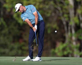 Corey Conners plays a shot on the 14th hole during the third round of The Players Championship at The Players Stadium course at TPC Sawgrass in Ponte Vedra Beach, Fla., Saturday, March 14, 2026.