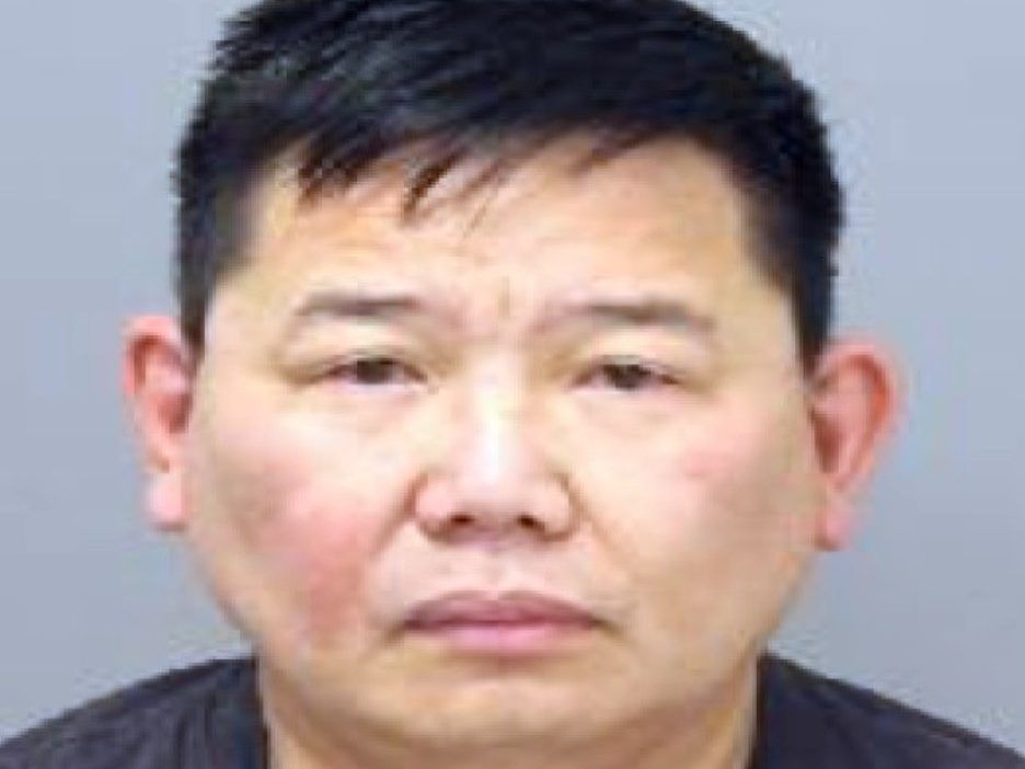 Francis Ambas, 45, of Toronto, is accused of using a hidden camera in a washroom at his workplace to secretly capture images of women for nearly four years.