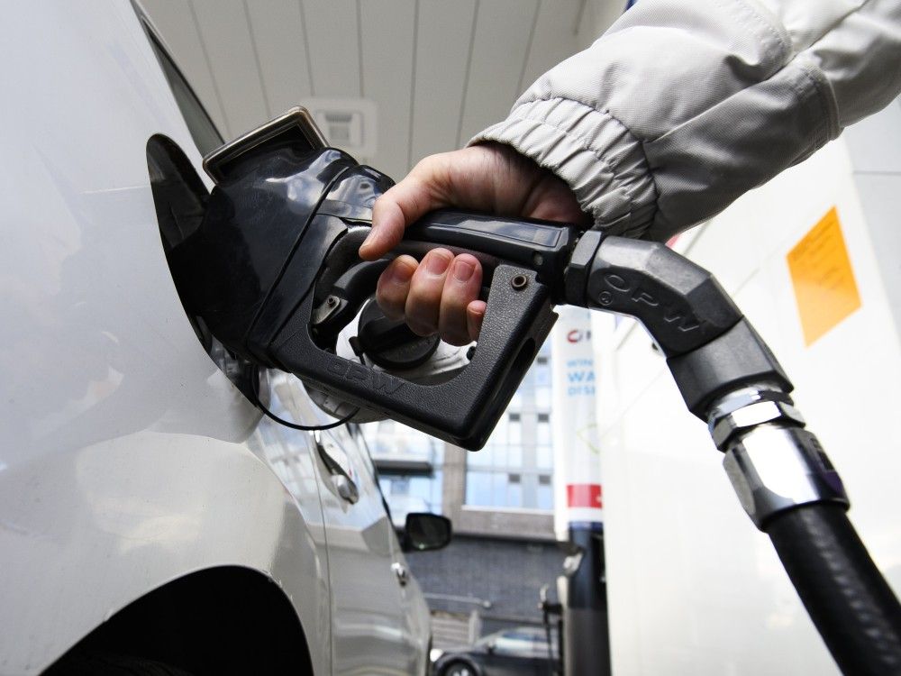 A person pumps gas at a gas station in Mississauga, Ont., Feb. 13, 2024.