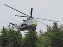A Sea King helicopter is flown by Britain's Prince William at Dalvay-By-The-Sea, P.E.I., with the Canadian Forces on July 4, 2011.