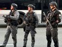 Toronto Police tactical officers patrol outside Rogers Centre ahead of the Blue Jays' season-opening game, Friday, March 27, 2026.