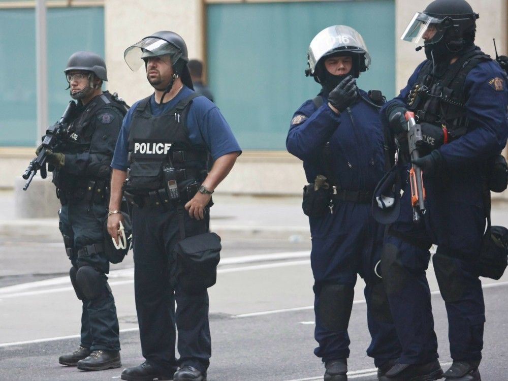 Police are seen in riot and tactical gear during the G20 summit in downtown Toronto, June 26, 2010.