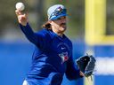 Toronto Blue Jays pitcher Kevin Gausman makes a throw to first base during a drill at Spring Training in Dunedin, Fla., on Monday, Feb. 16, 2026.