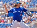 Toronto Blue Jays pitcher Kevin Gausman (34) pitches to Canada during the first inning of an exhibition baseball game Tuesday, March 3, 2026, in Dunedin, Fla.