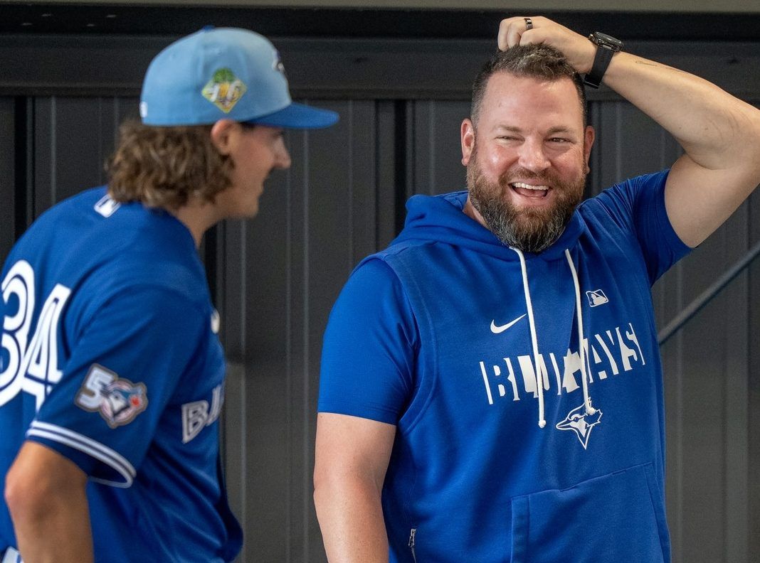 John Schneider and pitcher Kevin Gausman
