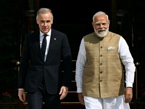 Prime Minister Mark Carney, left, and India's Prime Minister Narendra Modi