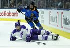 Minnesota Frost forward Abby Hustler battles for the loose puck while lying on the ice as Sceptres defender Ella Shelton defends on Sunday, March 8, 2026 at the Coca Cola Coliseum.
