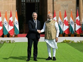 Prime Minister Mark Carney shakes hands with India's Prime Minister Narendra Modi before their meeting at the Hyderabad House in New Delhi on March 2, 2026.